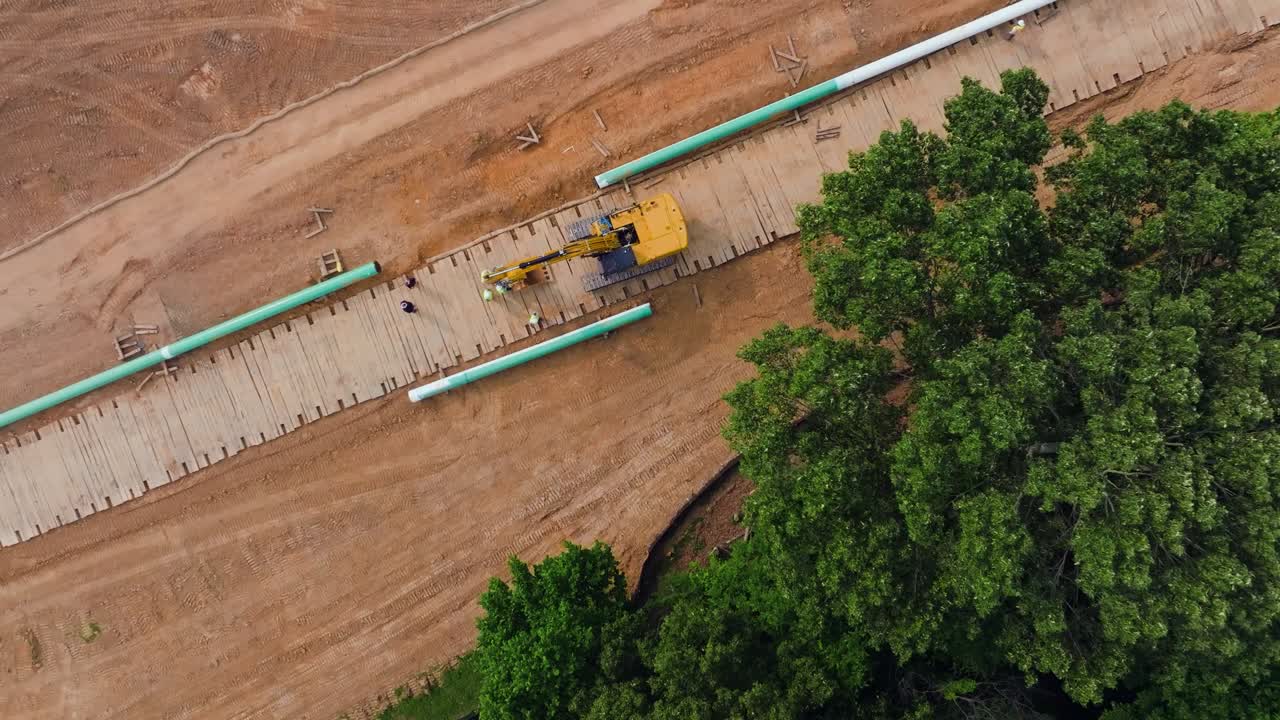 Aerial view of a pipeline right-of-way cut through farmland and forest